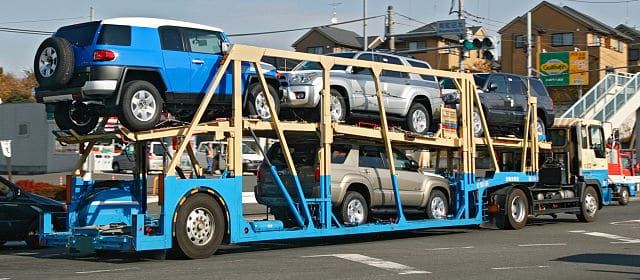 A semi-trailer truck with multi-car trailer